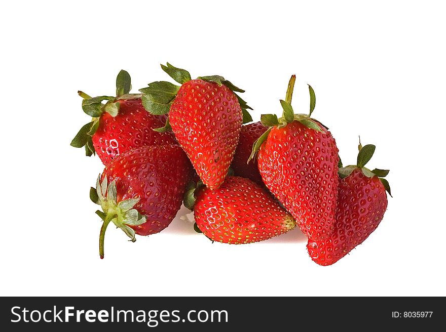 Pile of ripe strawberrys against a white background