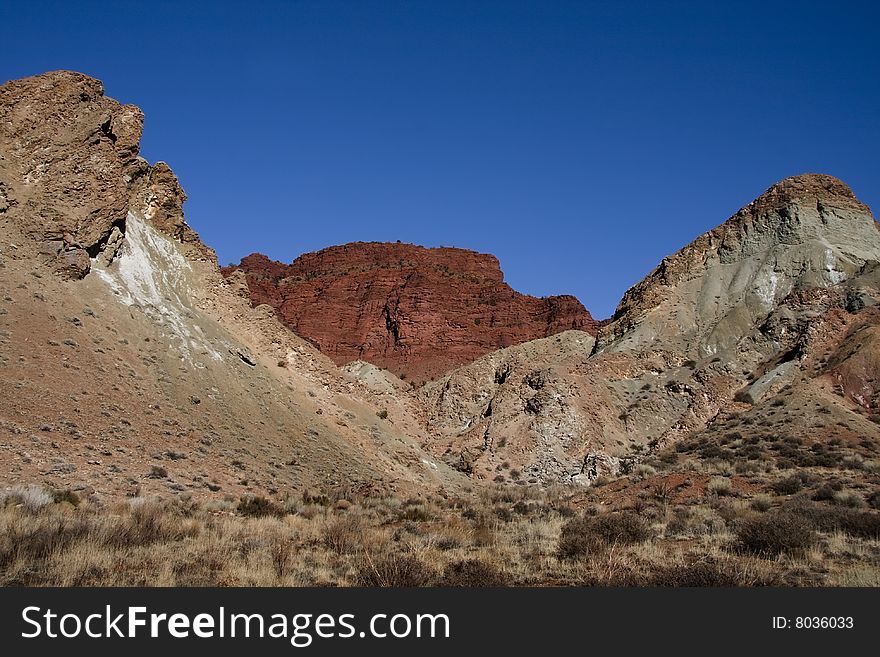 View of the red rock formations in Canyonlands National Park with blue sky�