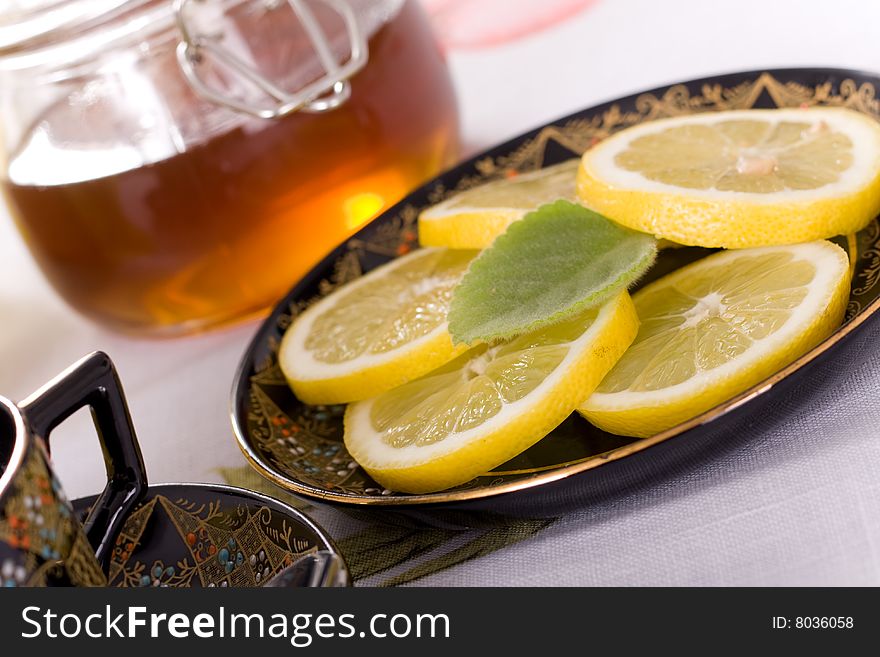 Slice citrus and cup of tea