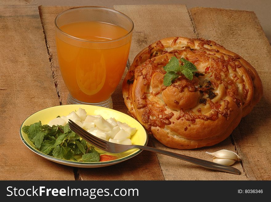 Freshly baked masala bread with juice.