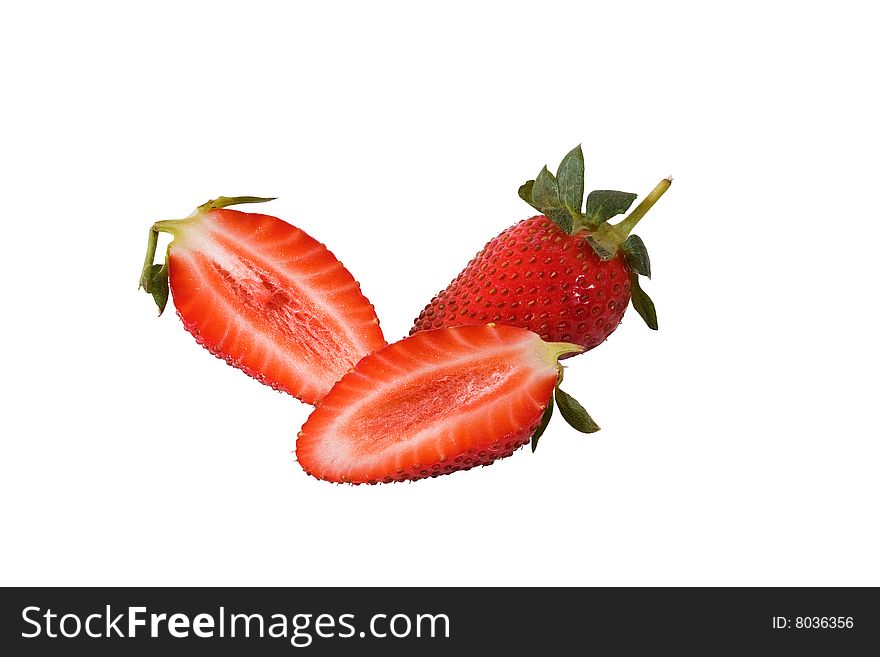 One whole strawberry with two halfs against a white background. One whole strawberry with two halfs against a white background