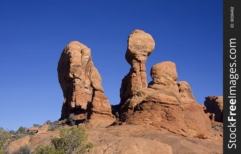 View of the red rock formations in Arches National Park with blue sky?