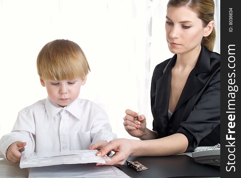 The beautiful businesswoman in a black jacket and boy. The beautiful businesswoman in a black jacket and boy