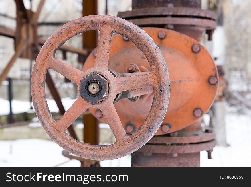 Old rusted hydrant in winter