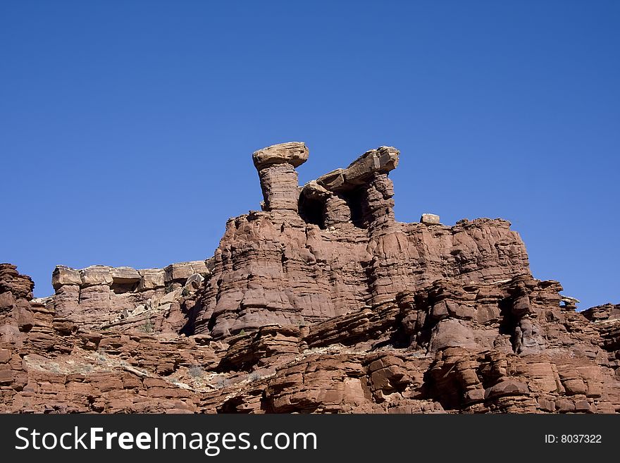 View of the red rock formations in Canyonlands National Park with blue sky�