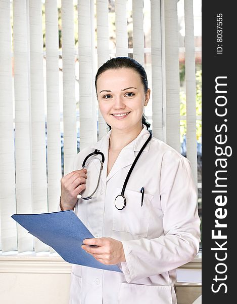 Portrait of female doctor standing in the office