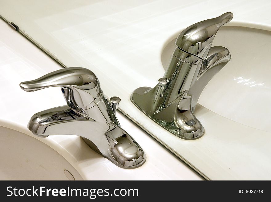 Lavatory chrome faucet and sink  with mirror reflection. Lavatory chrome faucet and sink  with mirror reflection