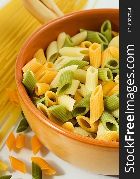 Colorful vegetables with pasta on white background. Colorful vegetables with pasta on white background