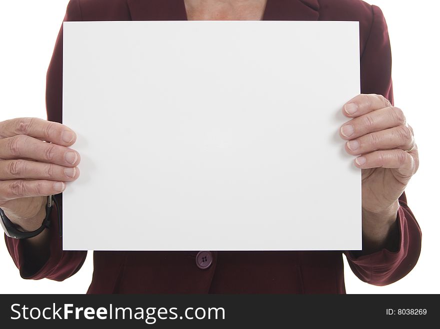 Large blank card held up by businesswoman