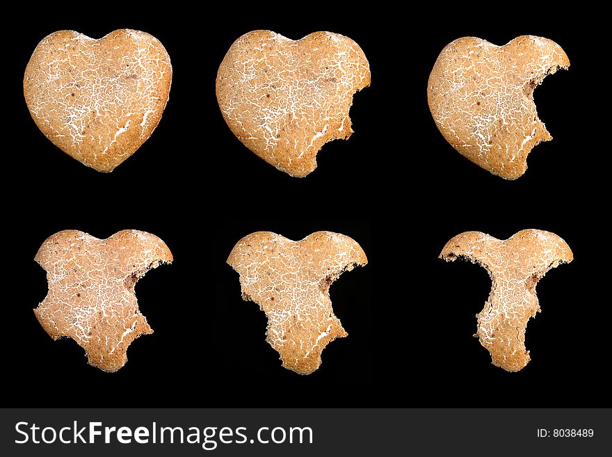 Biscuit hearts on the black background. Biscuit hearts on the black background