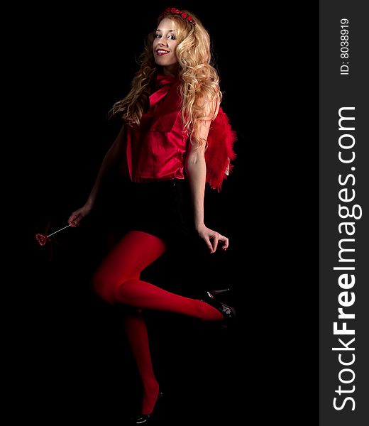 Beautiful teen lady in angel dress on black background. Beautiful teen lady in angel dress on black background