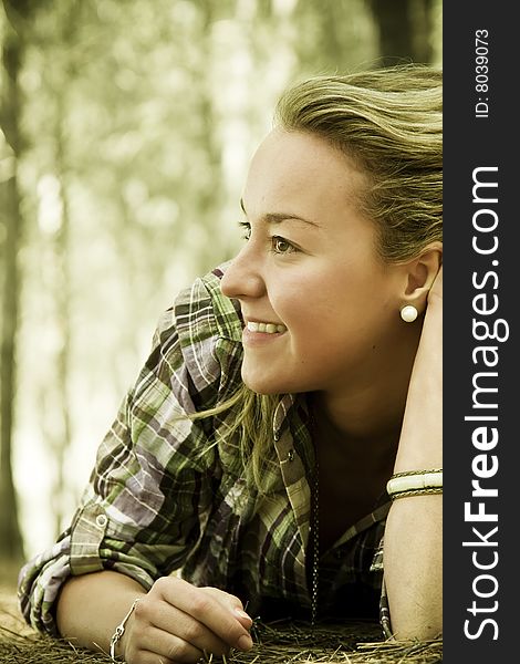 Happy young woman in autumn background