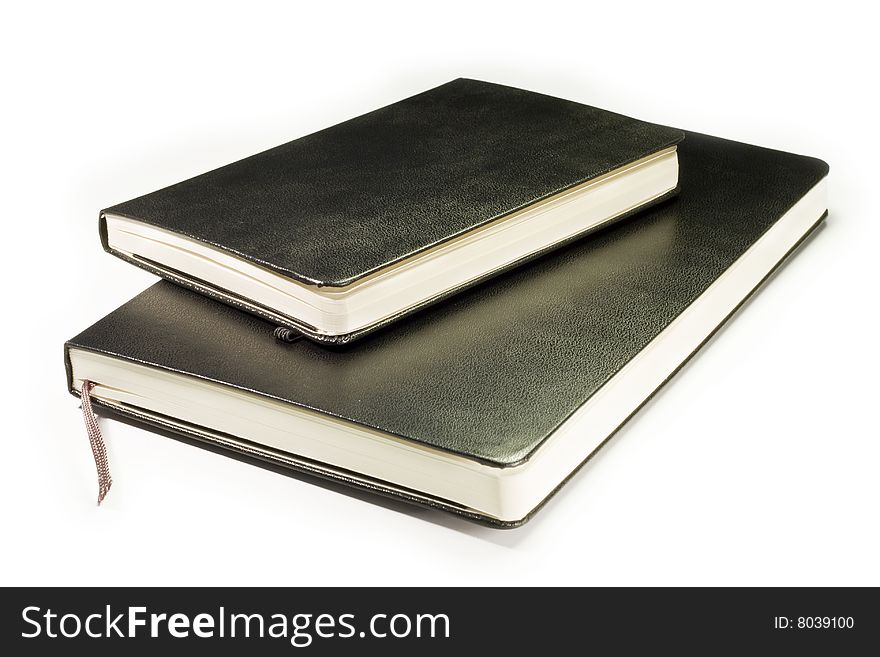 Two blacks notebooks with soft shadow on white background. Two blacks notebooks with soft shadow on white background