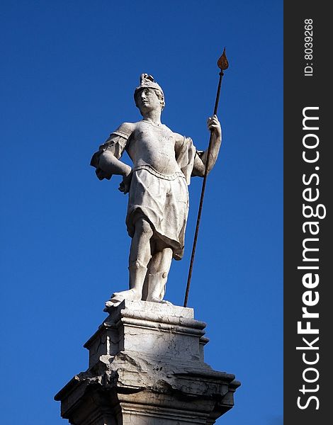 Marble soldier against blue sky