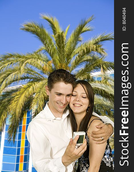 Couple over palm trees in the city of nice in france