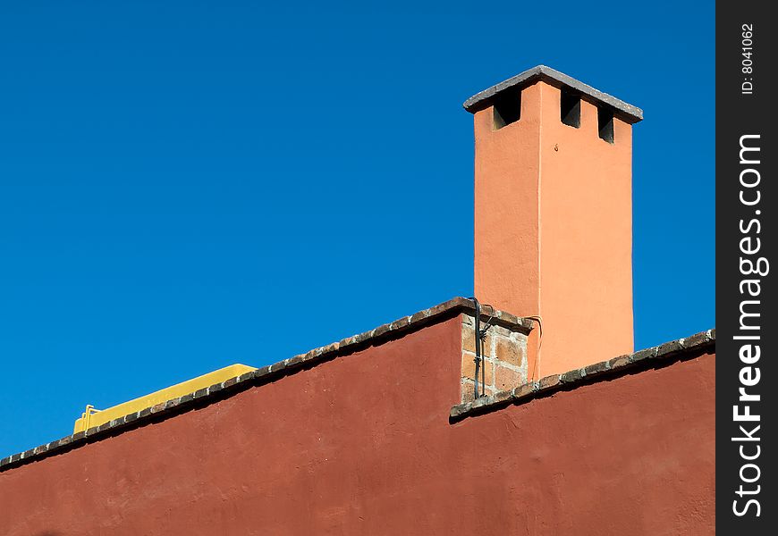 House detail showing chimney stack, San Miguel de Allende, Mexico. House detail showing chimney stack, San Miguel de Allende, Mexico.