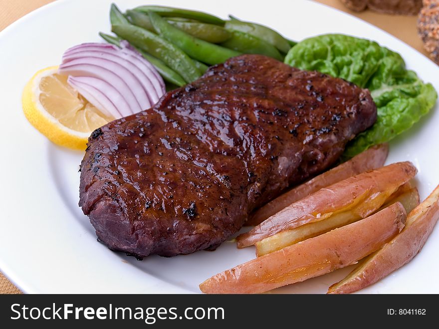 Roast Beef with green Beans and red potatoes.