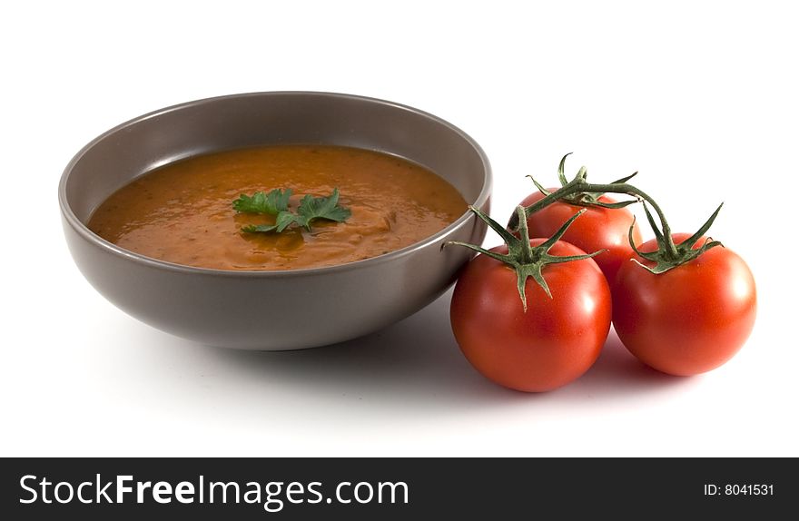 Close up of red pepper soup with tomatoes
