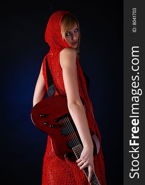 Portrait of a young woman with red electric guitar. Portrait of a young woman with red electric guitar