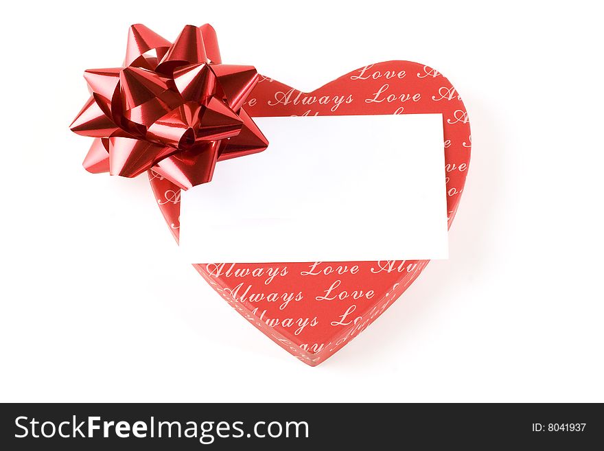 Red heart with ribbon on white background