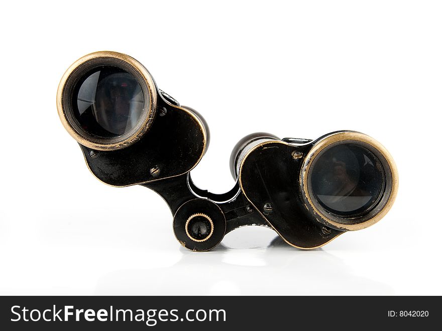 Old military style binoculars over white background