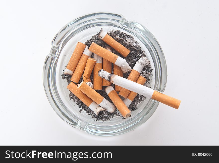 Cigarettes butts laying in ashtray. Cigarettes butts laying in ashtray