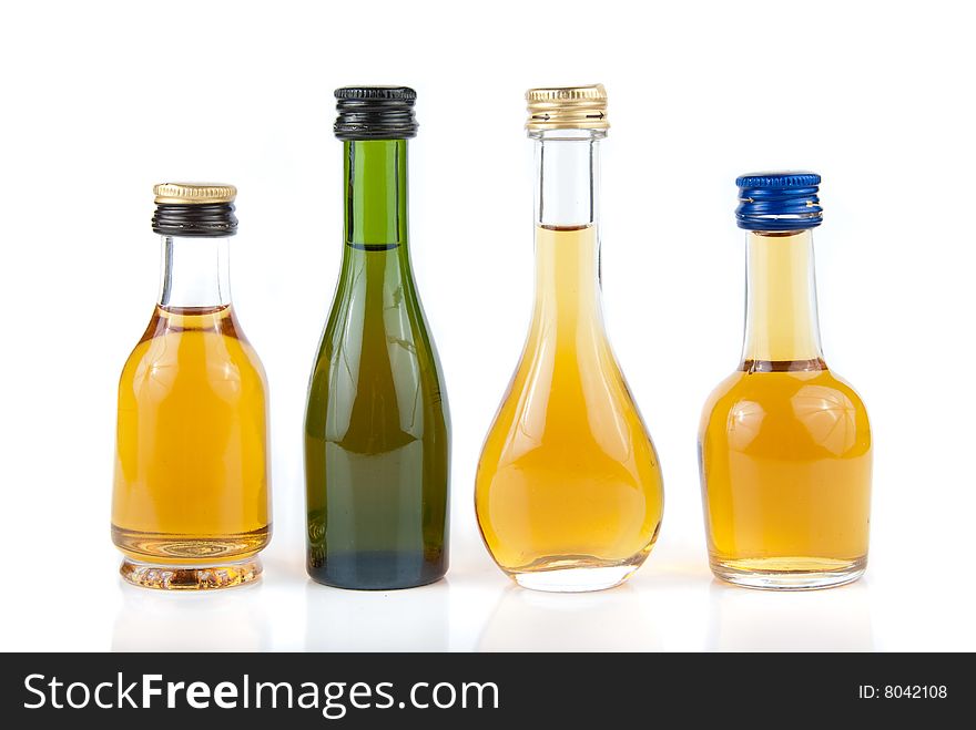 Full minibar bottles isolated over white background