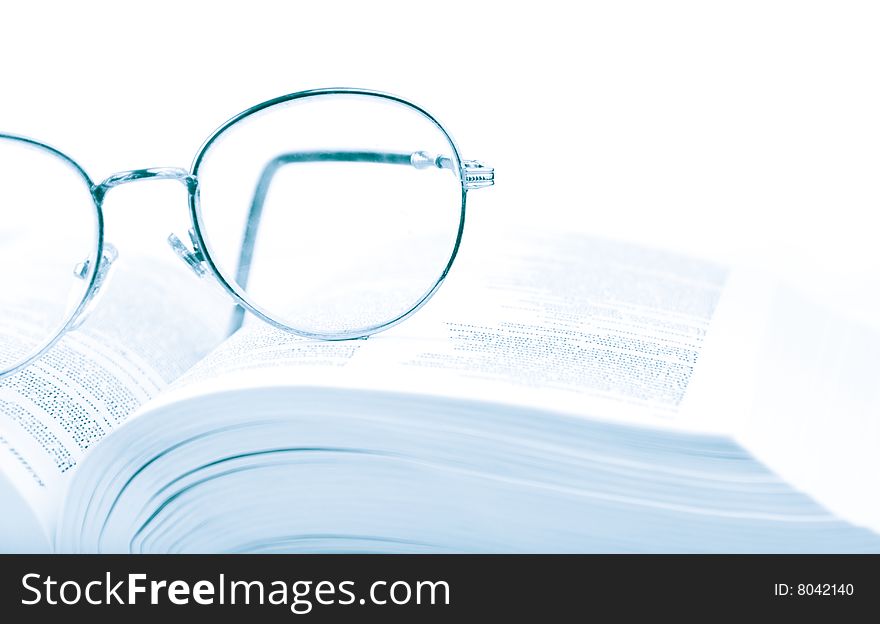 Glasses On The Open Book