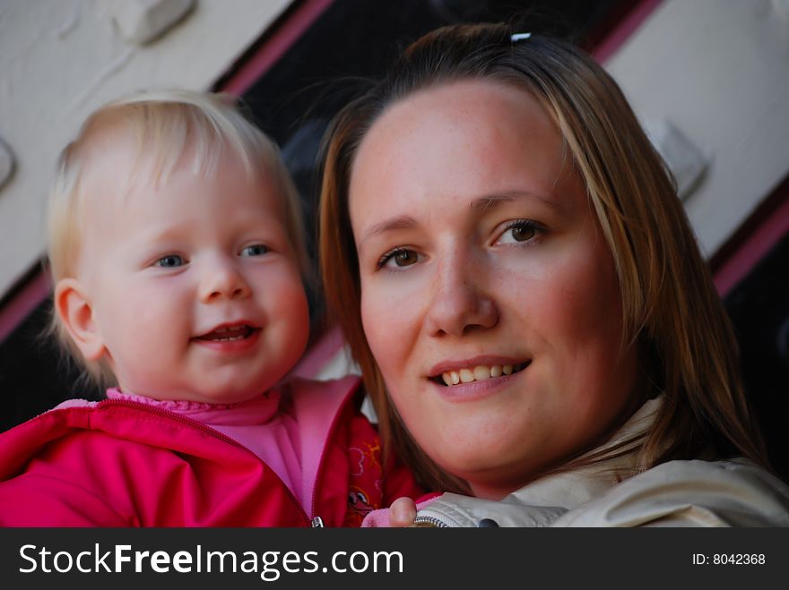 Mother with a little girl on hands. Mother with a little girl on hands