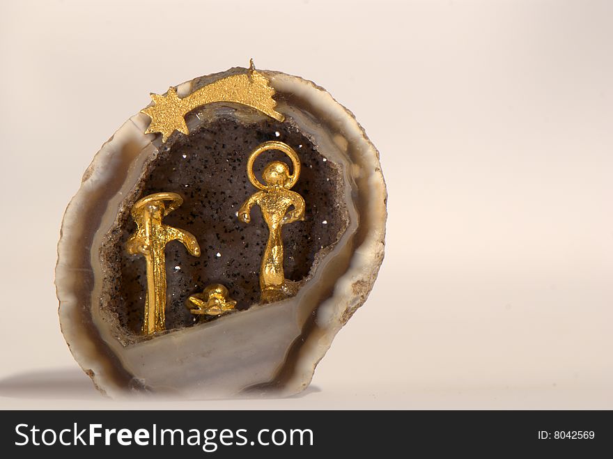 Golden nativity into a little geode