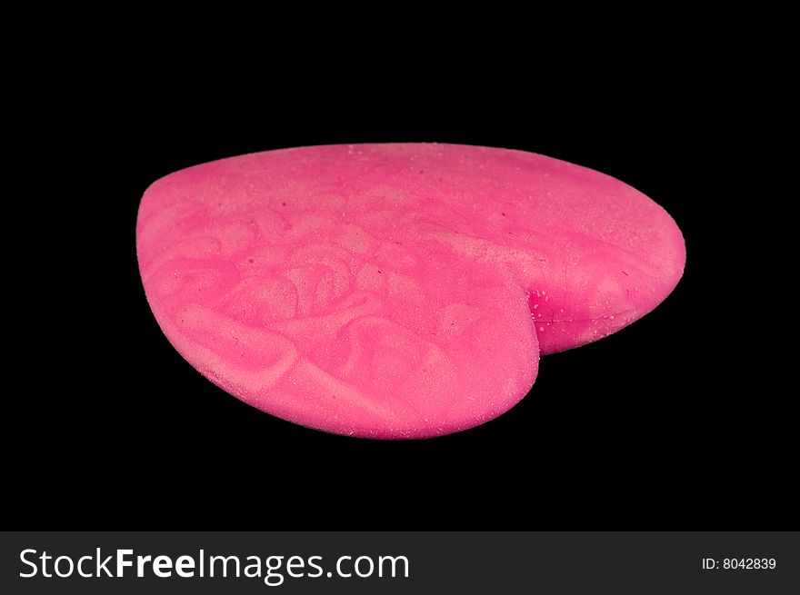 Nice pink eraser isolated on black