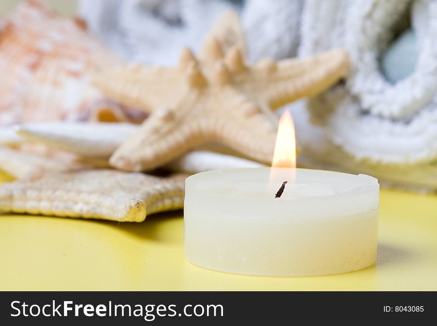 Candle  on a yelow background