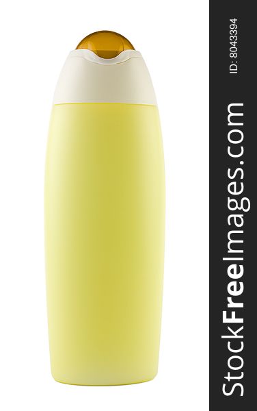 Bath cosmetics - a detail of a yellow shampoo or body lotion bottle with copy space, isolated on white. Bath cosmetics - a detail of a yellow shampoo or body lotion bottle with copy space, isolated on white.