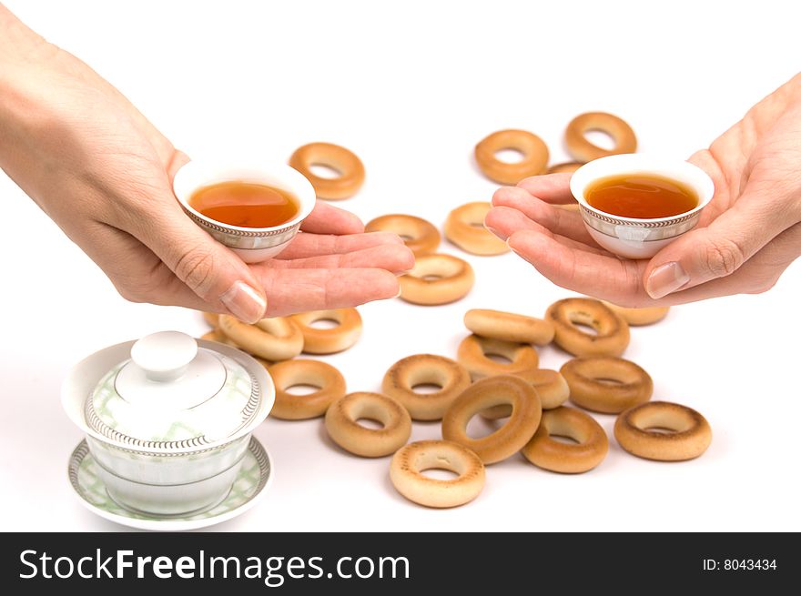 Traditional chinese tea service and bread-rings around. Traditional chinese tea service and bread-rings around