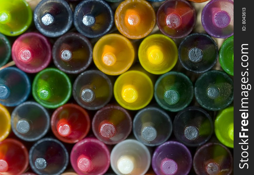 View of a pile of crayons photographed from the tips.