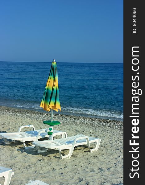 Folded Umbrella On A Beach