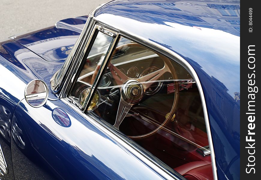 Old blue car with mirror