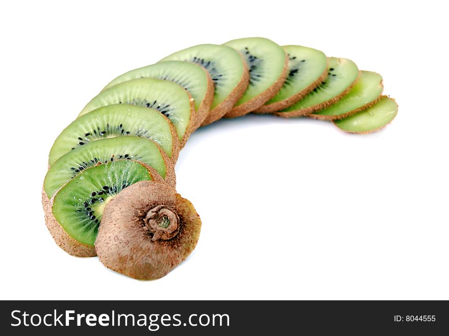 Beautiful green texture consisting of slices of kiwifruit on a white background