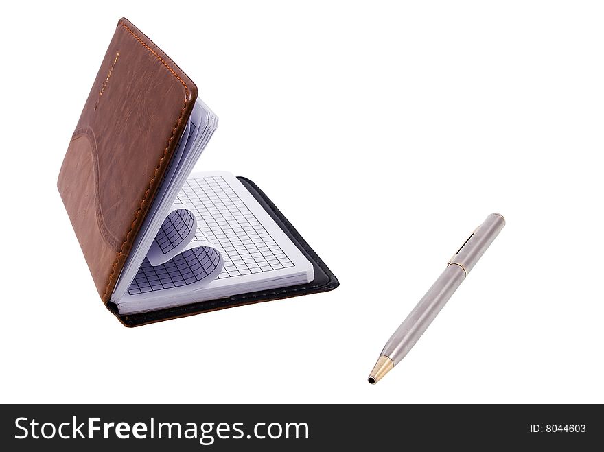 Notebook and a silver pen isolated on a white background