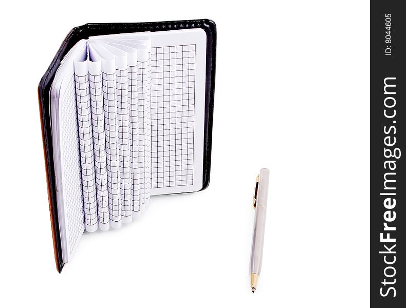 Notebook and a silver pen isolated on a white background