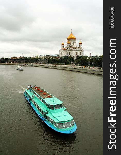 The vessel moves across the Moskva River against a temple. The vessel moves across the Moskva River against a temple.
