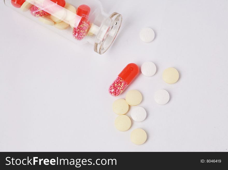 Pill and  bottle with white background. Pill and  bottle with white background