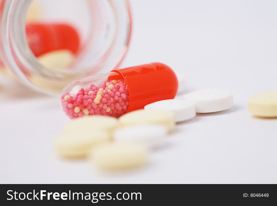 Pill and  bottle with white background. Pill and  bottle with white background