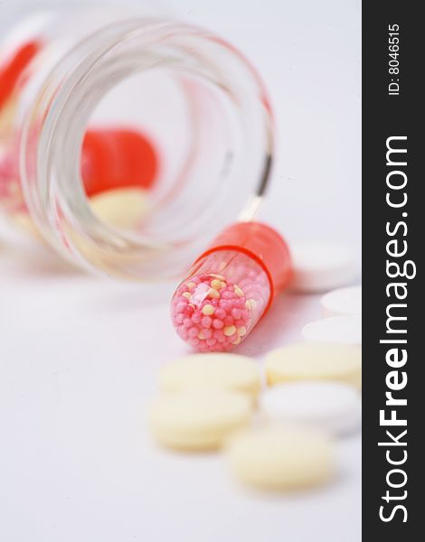 Pill and  bottle with white background. Pill and  bottle with white background