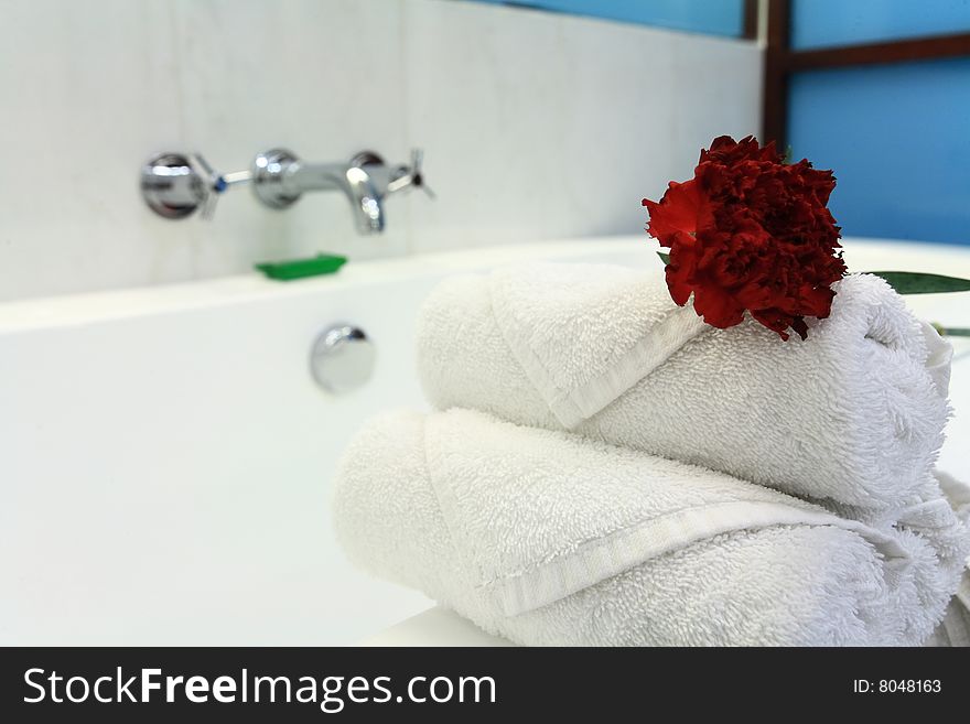 White bathtub with towel in bath room