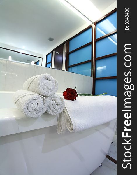 White bathtub with towel in bath room