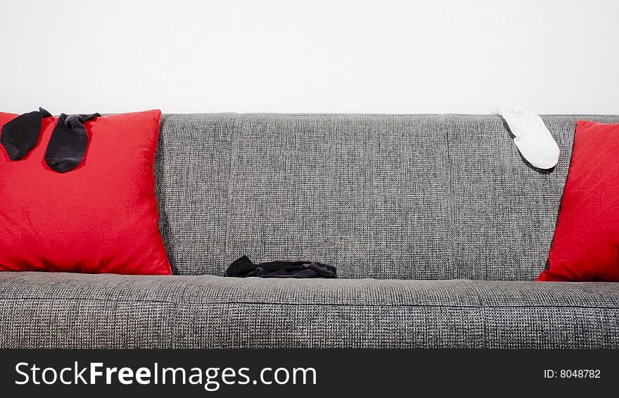 Socks in a sofa with pillows. Socks in a sofa with pillows