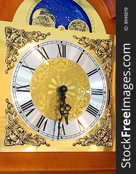 Close up shot of clock dial in gold