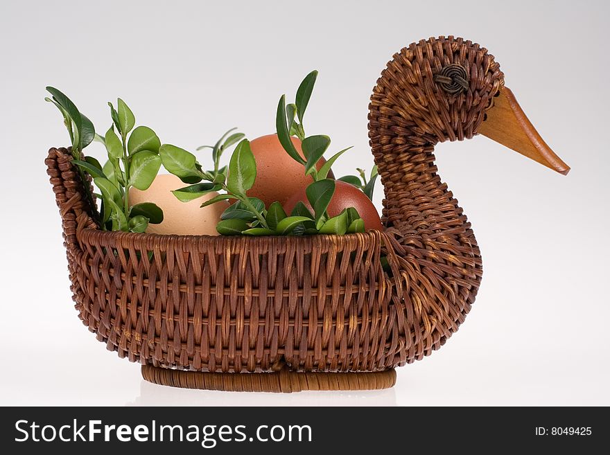 Easter duck with eggs and green twigs isolated on white background. Easter duck with eggs and green twigs isolated on white background