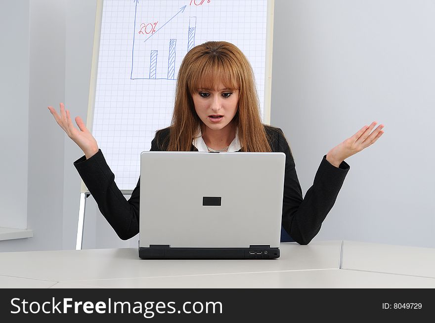 Young business woman working on a laptop.